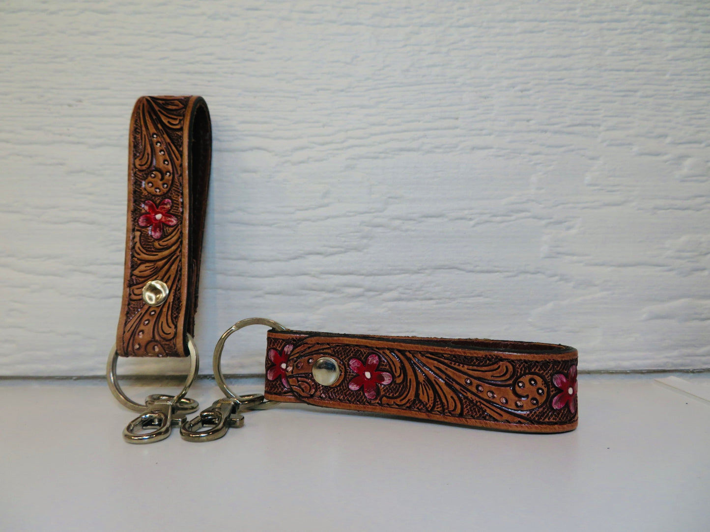 Tooled leather with painted red flowers