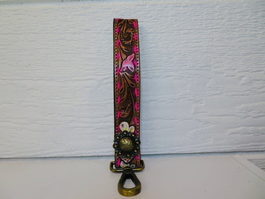 Brown with hot pink buck stitching with concho and painted flowers